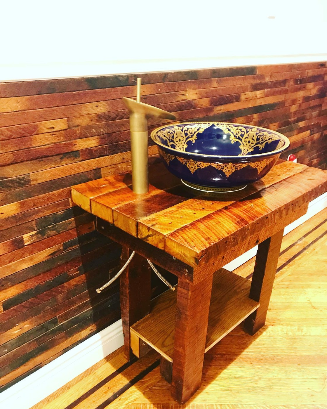 Custom live-edge wood bar with decorative vessel bowl