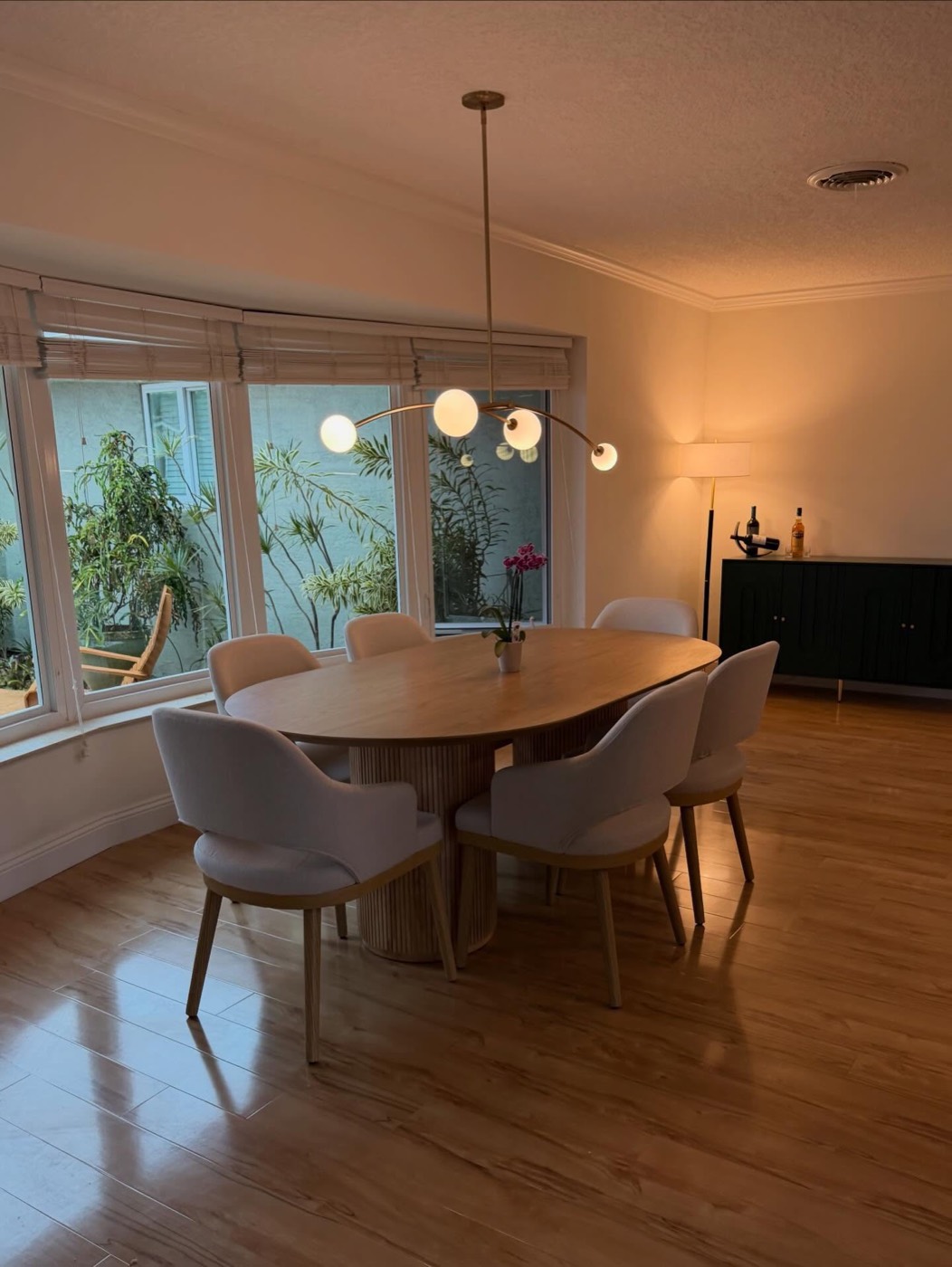 Renovated dining room with new flooring and lighting