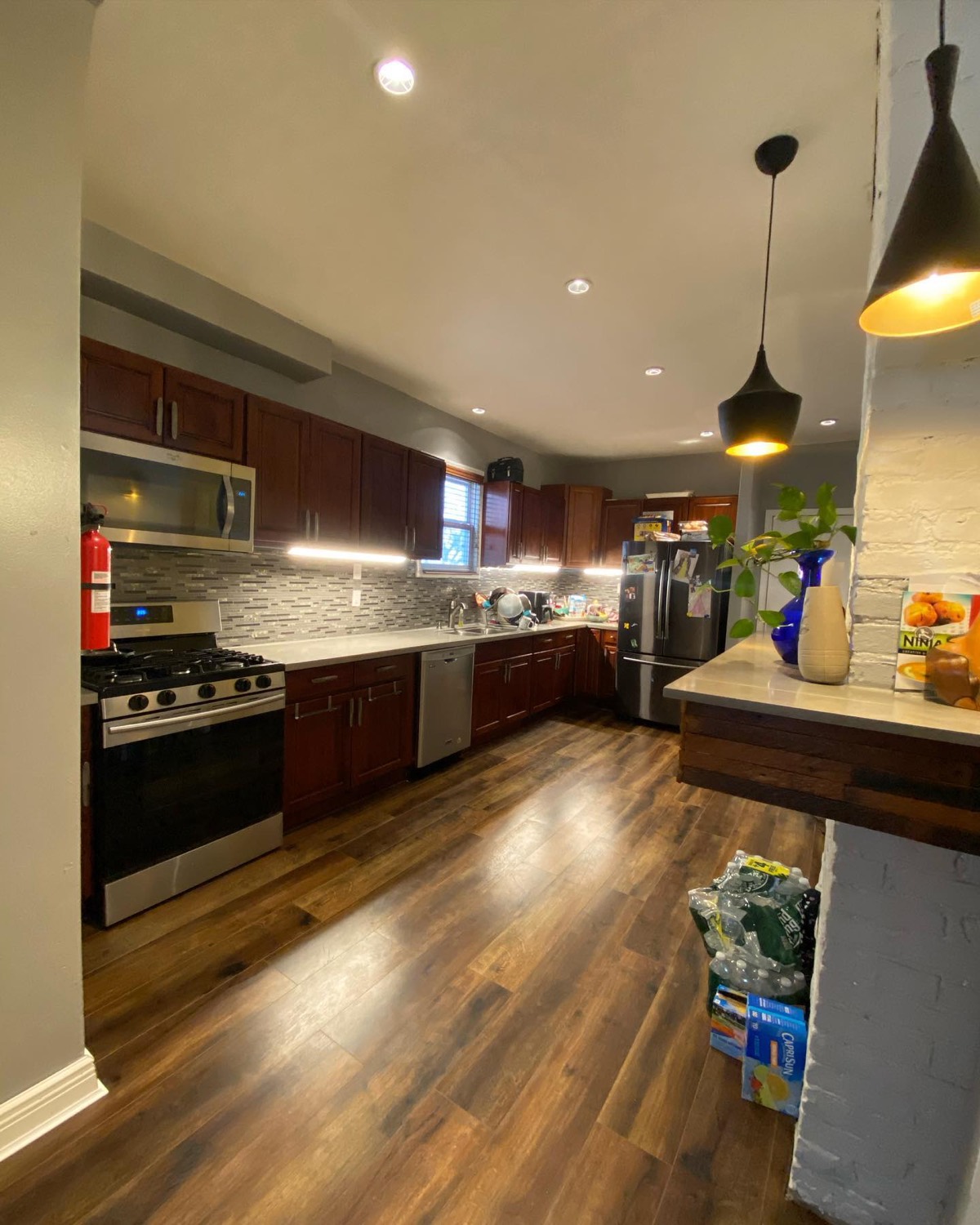 Finished kitchen remodel with new cabinets and lighting
