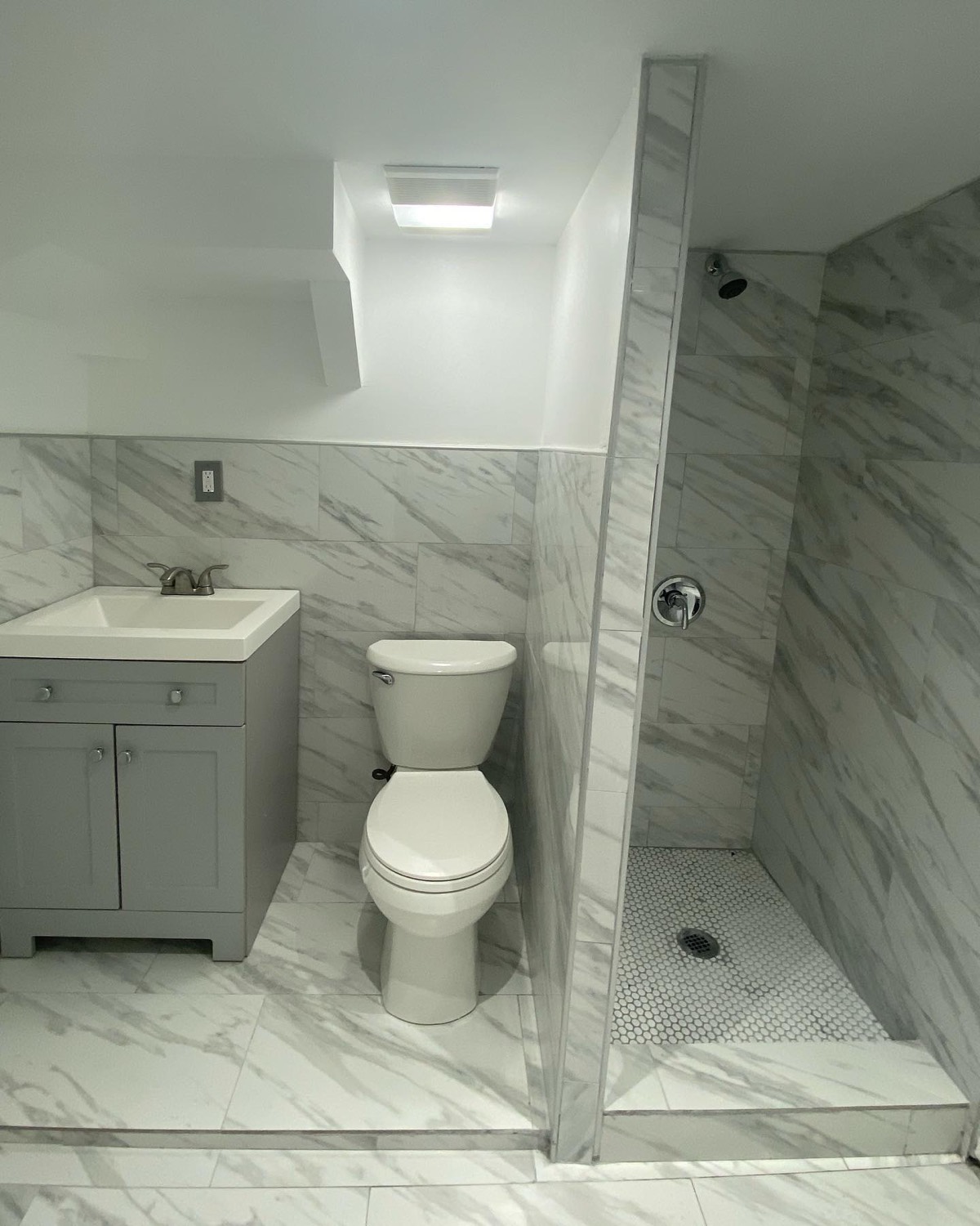 Marble bathroom with walk-in shower and new vanity